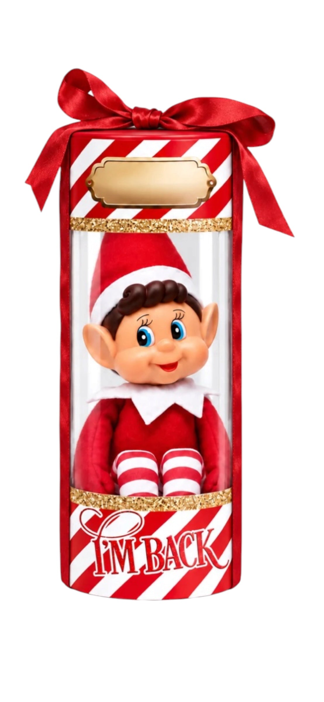 A Christmas-themed cylindrical gift box with a clear window displaying an elf doll dressed in red and white. The box has red-and-white diagonal stripes, a red ribbon bow at the top, a blank gold label, and the text 'I'M BACK' in red script near the bottom.