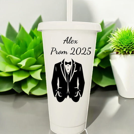 White tumbler with black tuxedo design and 'Alex Prom 2025' text, set against a white background with green plants.