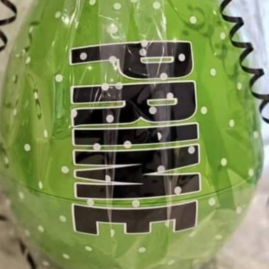 Green ball with black text and a black and green ribbon on a light background