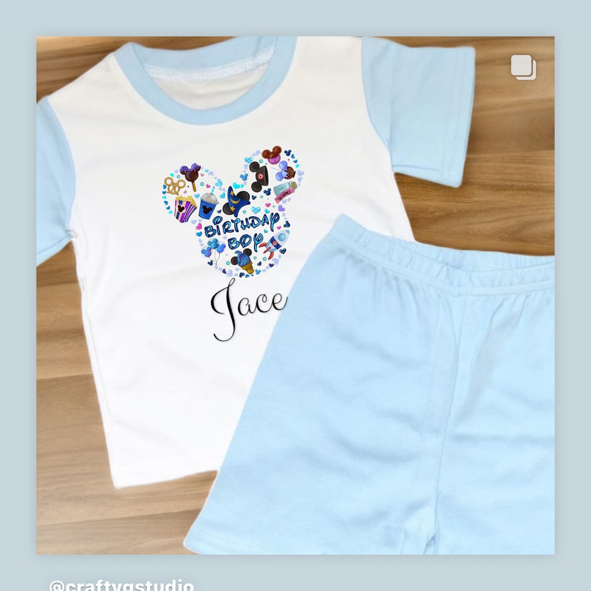 A set of children's pajamas with blue coloring, featuring a graphic design on the front and a customizable name 'Jacob' printed on the back.