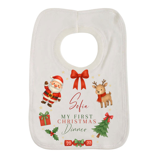 Christmas-themed baby bib with Santa Claus, reindeer, and festive elements on a white background.