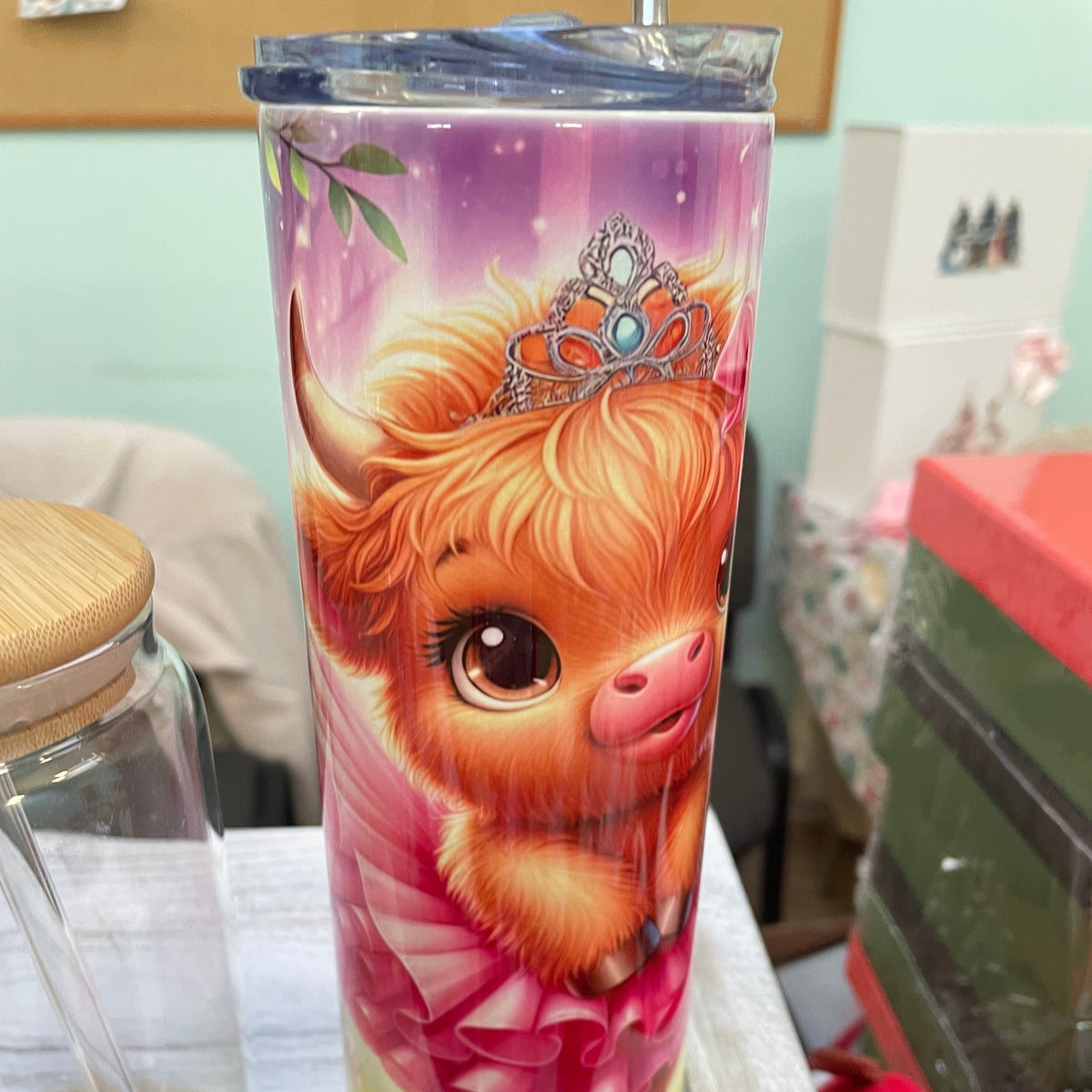 Tumbler with a colorful design of a character on a white surface